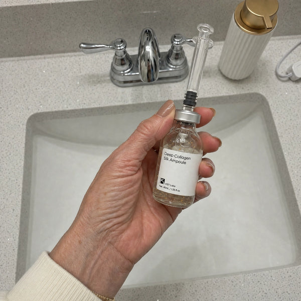 Julie’s review photo showing the ampoule at a bathroom sink