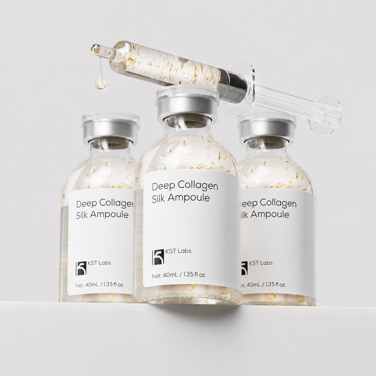 Ampoule applicator and box together with silk threads visible
