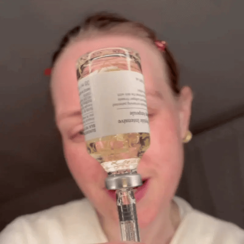 Collagen Silk Ampoule held up to the light