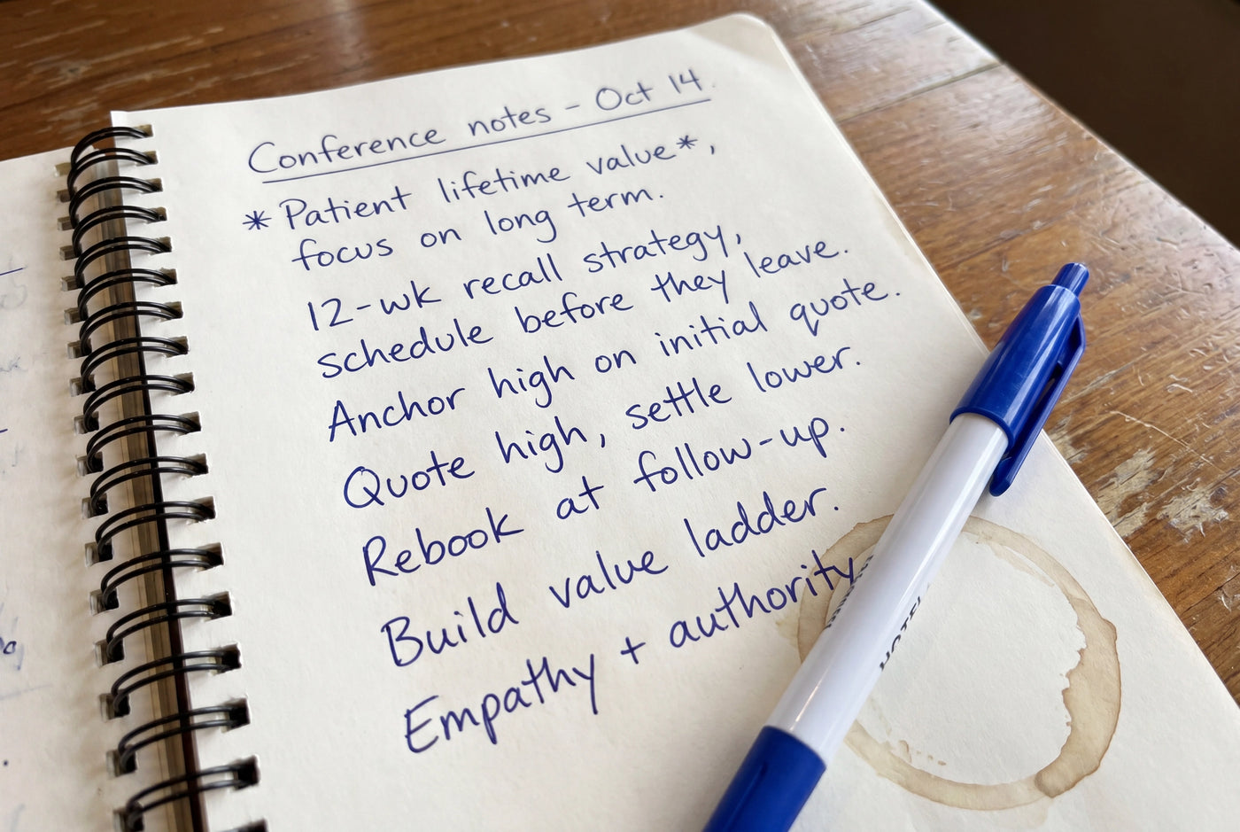Notepad with handwritten notes from a business seminar